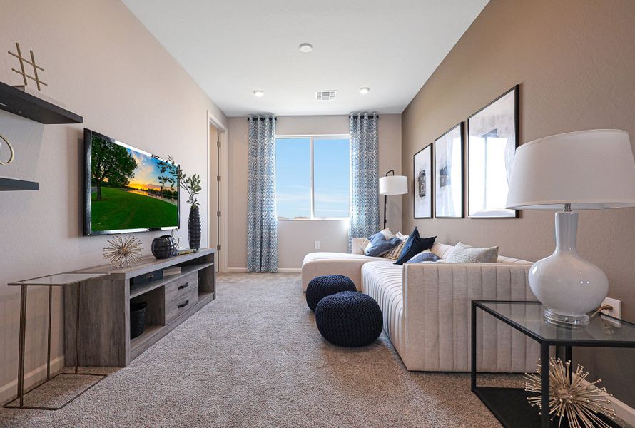 A living room with a tv and couches. A living room with a tv and couches.