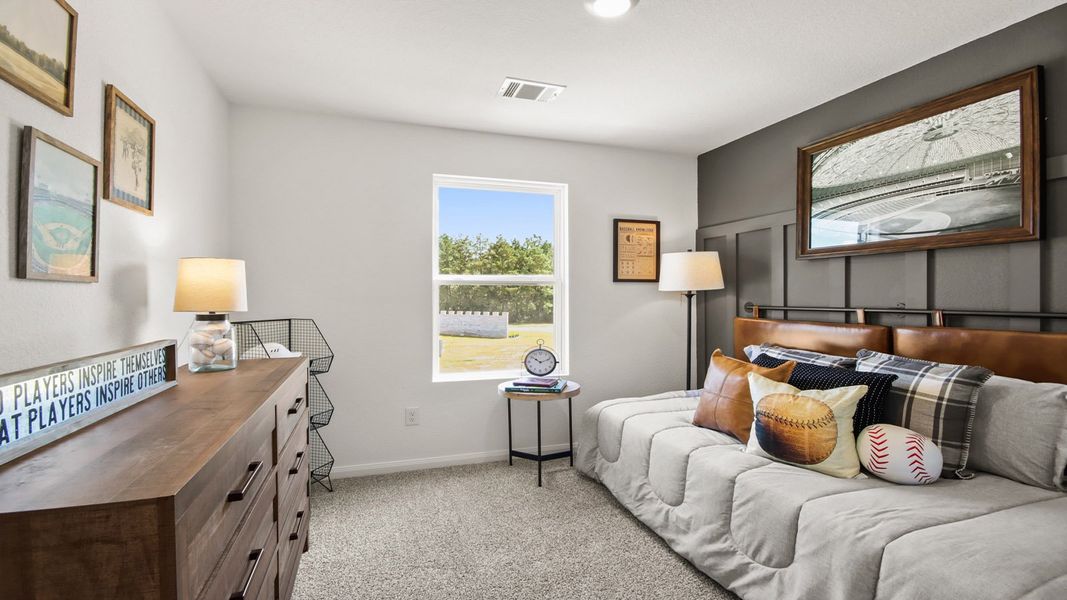 Furnished interior in a model home at Castles Edge in Willis (Image 12).