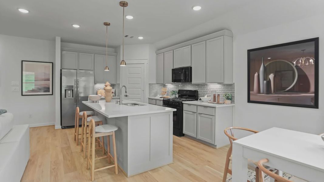 Elegant Mostyn Springs kitchen features sleek cabinetry, quartz island, and refined pendant lighting. Elegant Mostyn Springs kitchen features sleek cabinetry, quartz island, and refined pendant lighting.