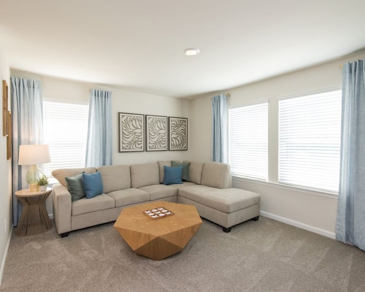 Relax on the cozy loft couch—great for unwinding or game nights. Relax on the cozy loft couch—great for unwinding or game nights.