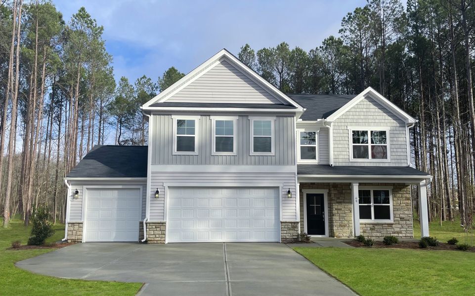 Front exterior of a home in the Magnolia Acres community, located in Fuquay Varina, NC (Image 14). Front exterior of a home in the Magnolia Acres community, located in Fuquay Varina, NC (Image 14).