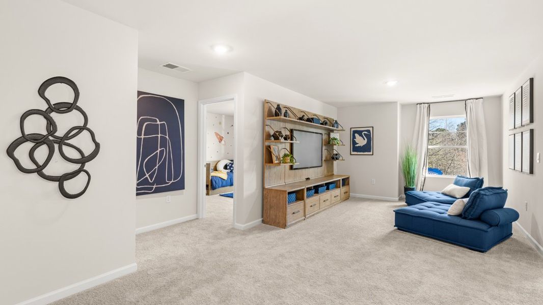 Furnished interior in a model home at Liberty Crossing in Braselton (Image 14).