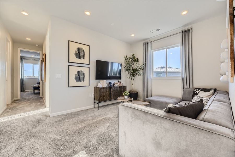 A living room with a tv and couches.