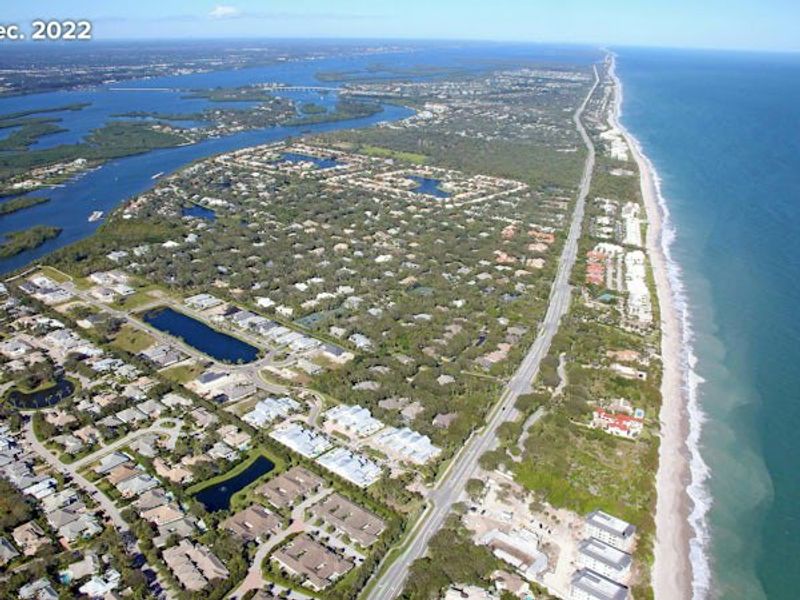 Aerial view of the The Strand community in Vero Beach, FL, showing layout and nearby surroundings (Image 28).