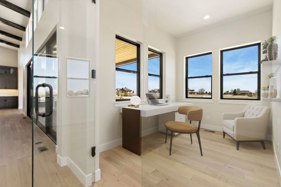 Furnished interior in a model home at Acadia at RainDance in Windsor (Image 12).