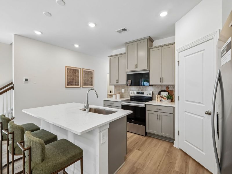Furnished interior in a model home at Rocky River Towns in Charlotte (Image 8).