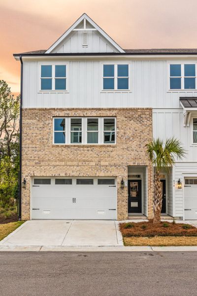 Front exterior of a home in the Anchors Bend Townes community, located in Wilmington, NC (Image 17).