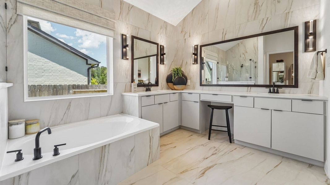 Revel in marble elegance and modern fixtures in Woodlands Hills' sophisticated bathroom design.