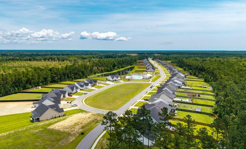 Aerial view of the The Enclave at French Quarter Creek community in Huger, SC, showing layout and nearby surroundings (Image 10).