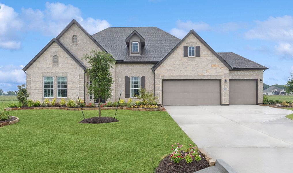 Front exterior of a home in the Tejas Landing community, located in Needville, TX (Image 1).