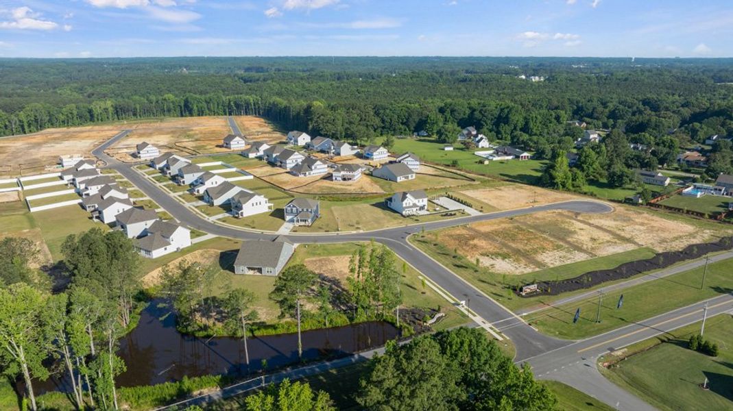 Aerial view of the Eagle Creek community in Fuquay Varina, NC, showing layout and nearby surroundings (Image 12). Aerial view of the Eagle Creek community in Fuquay Varina, NC, showing layout and nearby surroundings (Image 12).