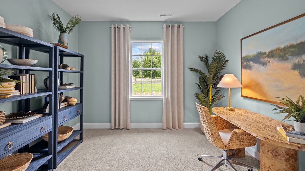 Furnished interior in a model home at Tyler - Home on the Lake in New Bern (Image 6).