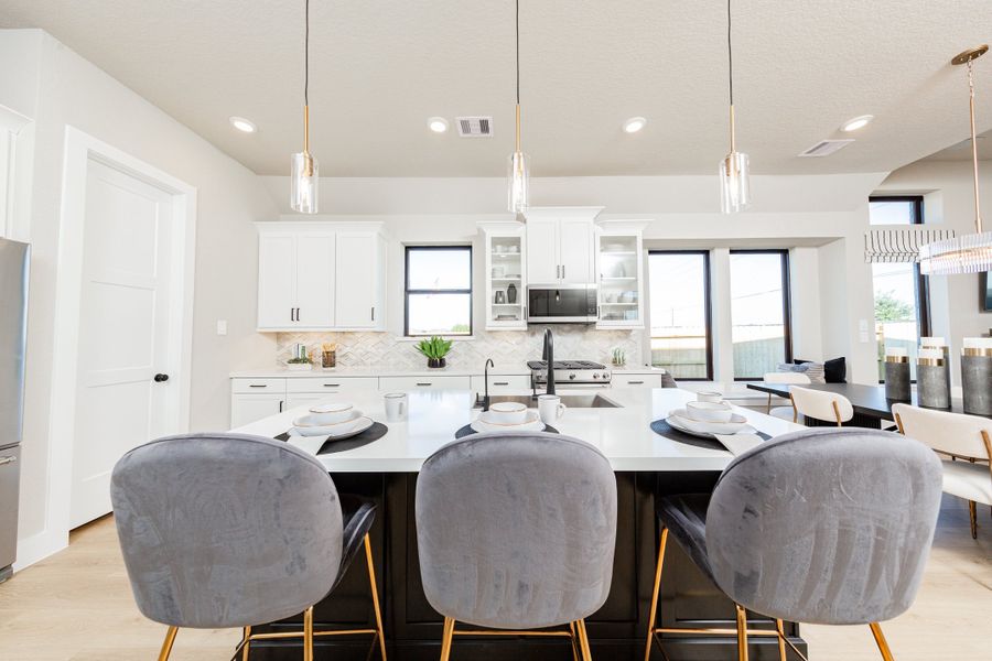 Furnished interior in a model home at Gatherings® at Chambers Creek: Duets in Willis (Image 5).