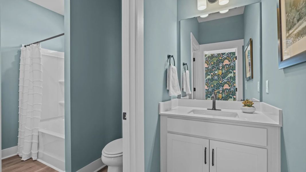 Separate vanities in secondary bathroom with shared shower at Pinebrook by DRB Homes in Woodruff, SC Separate vanities in secondary bathroom with shared shower at Pinebrook by DRB Homes in Woodruff, SC