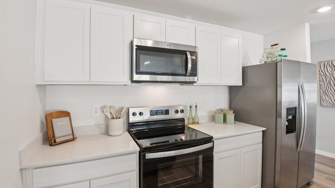 Furnished interior in a model home at Brighton Park in Hudson (Image 17).