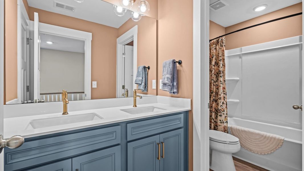 Accomplished bathroom design with sleek tile, high-quality cabinetry, and refined hardware Accomplished bathroom design with sleek tile, high-quality cabinetry, and refined hardware