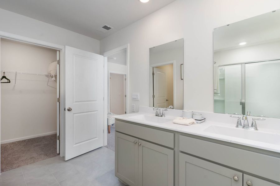 Furnished interior in a model home at Island Green in Myrtle Beach (Image 37).