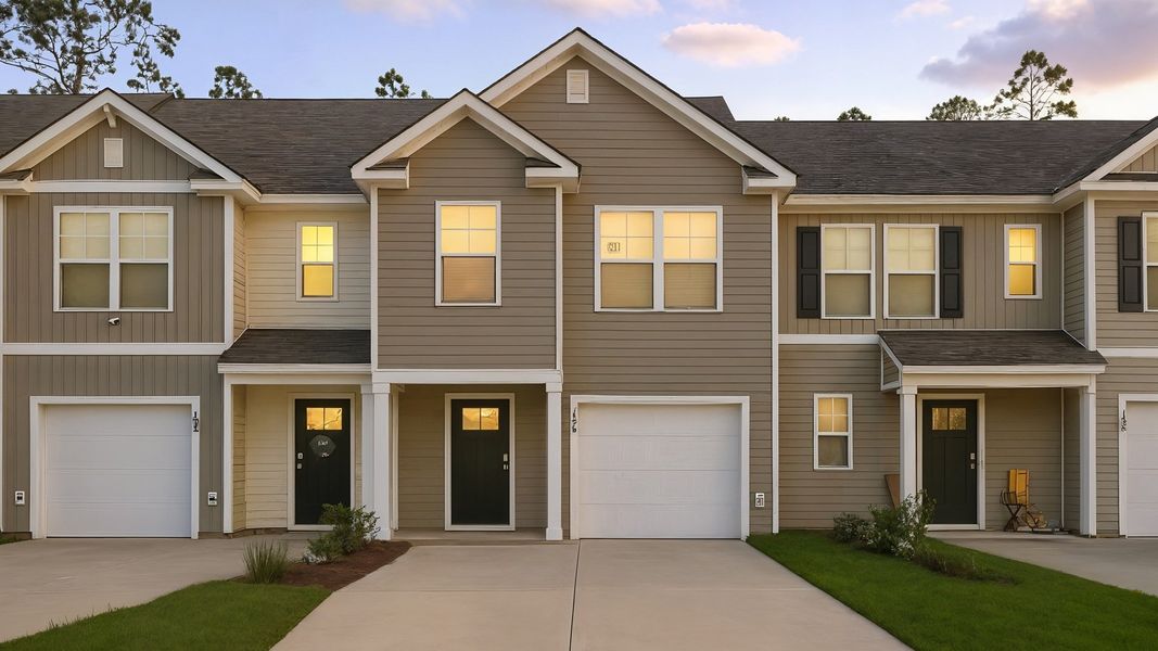 Front exterior of a home in the Pine Hills Townhomes at Cane Bay community, located in Summerville, SC (Image 2).
