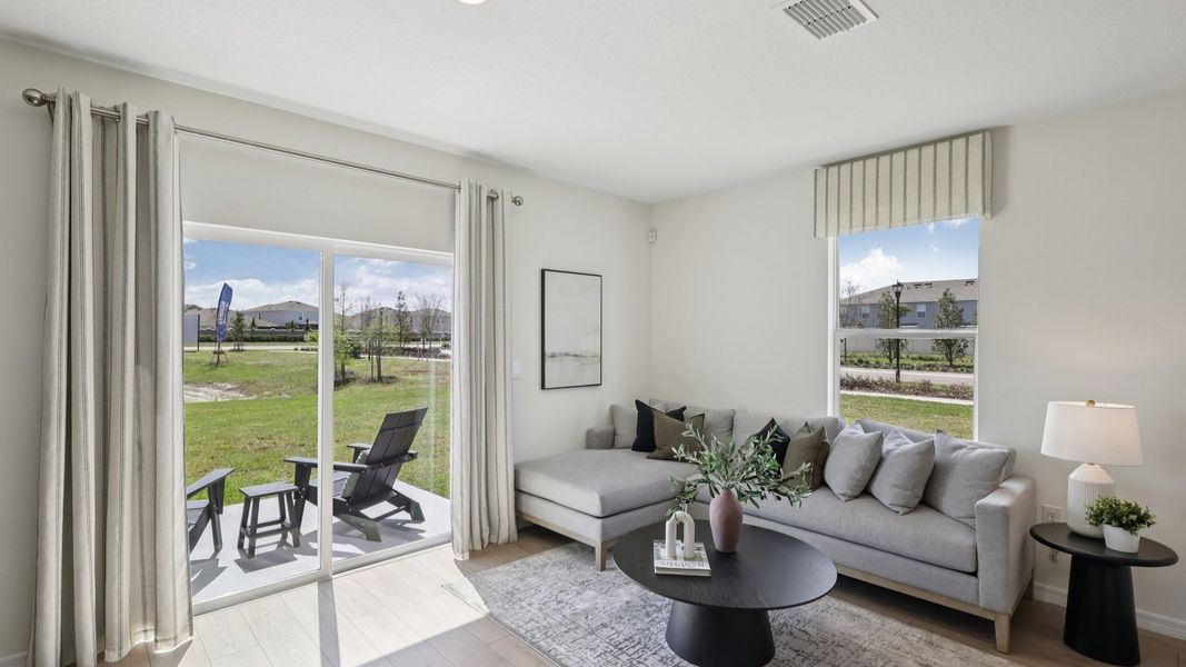 Furnished interior in a model home at Towns at Woodsdale in Wesley Chapel (Image 13).
