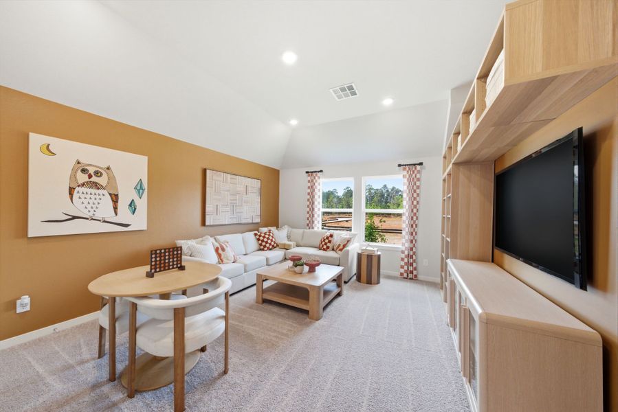 A living room with a tv and couches.