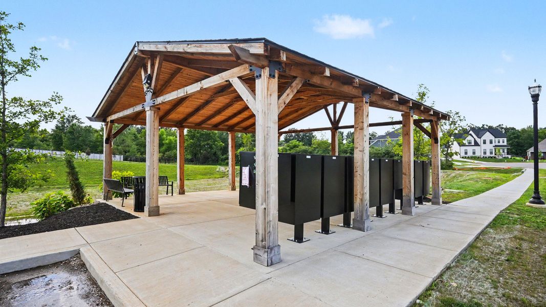 Pavilion over mail kiosk with sidewalks connecting to it Pavilion over mail kiosk with sidewalks connecting to it