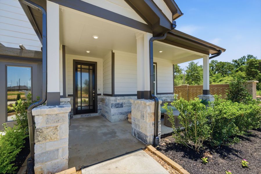 A house with a stone patio. A house with a stone patio.