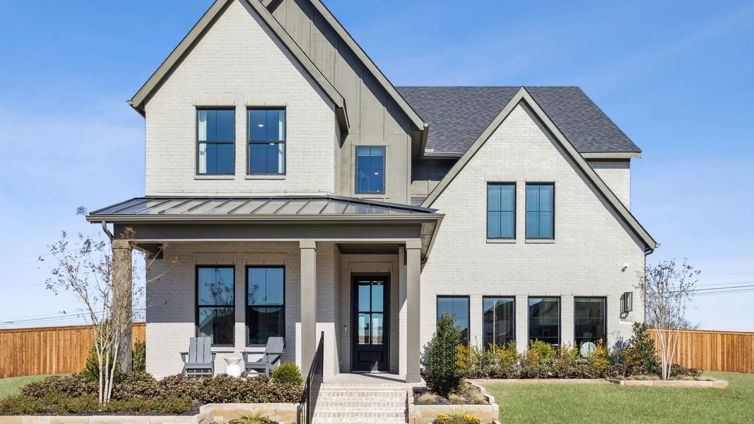 Front exterior of a home in the Village on Main Street community, located in Frisco, TX (Image 5). Front exterior of a home in the Village on Main Street community, located in Frisco, TX (Image 5).
