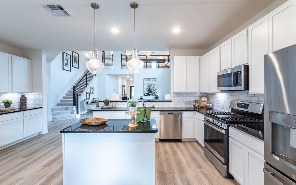 Furnished interior in a model home at Infinity Square in Kyle (Image 15).