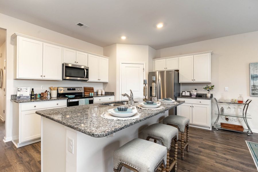 Furnished interior in a model home at Island Green in Myrtle Beach (Image 54).