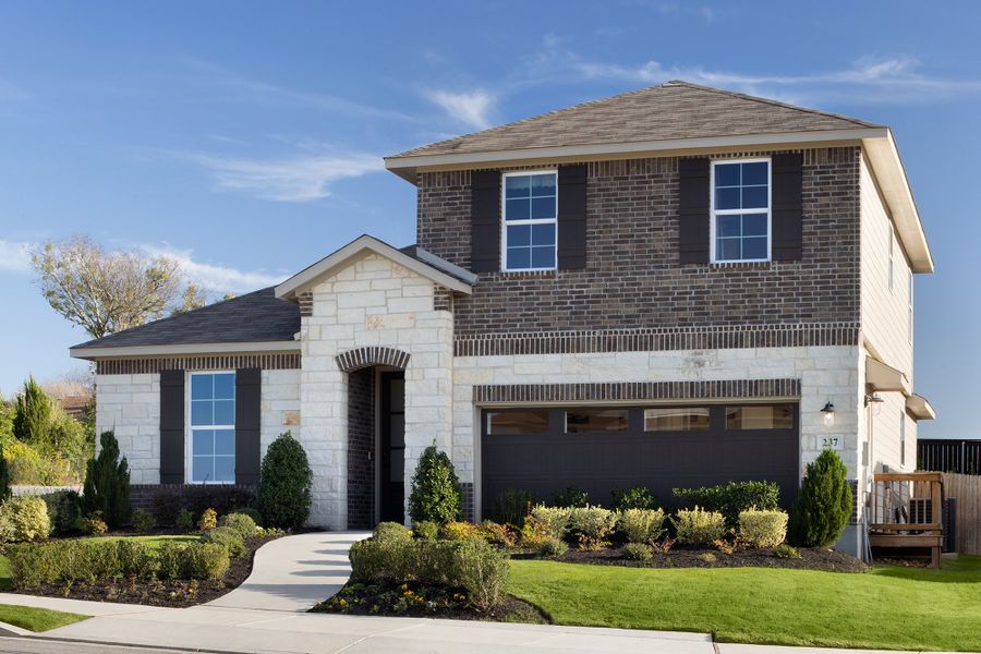 Front exterior of a home in the Saddle Creek Ranch community, located in Cibolo, TX (Image 4).