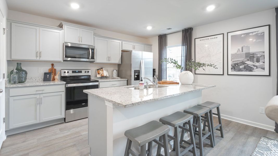 Furnished interior in a model home at Preston Oaks in King (Image 4).