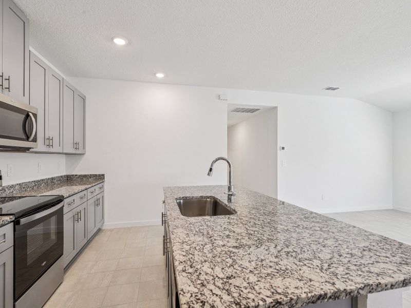Furnished interior in a model home at Lakes at Bella Lago - Premier Series in Green Cove Springs (Image 5).