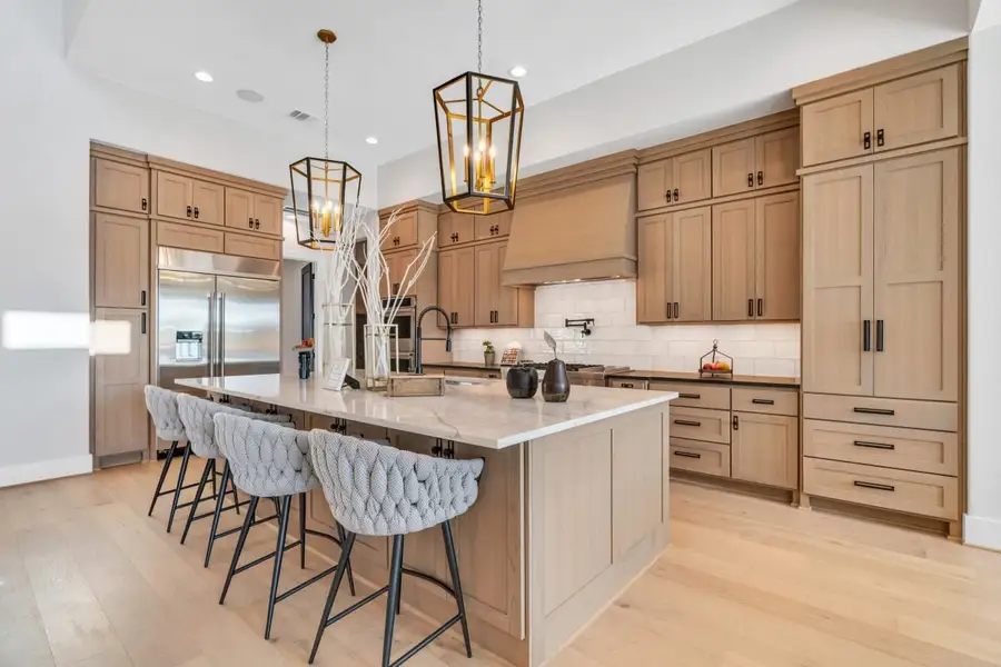 Furnished interior in a model home at Sienna in Missouri City (Image 5).