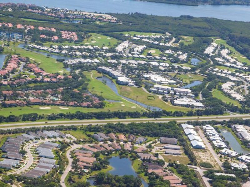 Aerial view of the The Falls at Grand Harbor community in Vero Beach, FL, showing layout and nearby surroundings (Image 11).