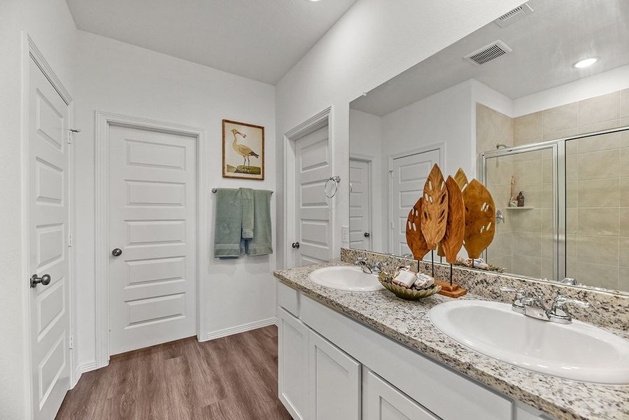 A bathroom with a large mirror. A bathroom with a large mirror.