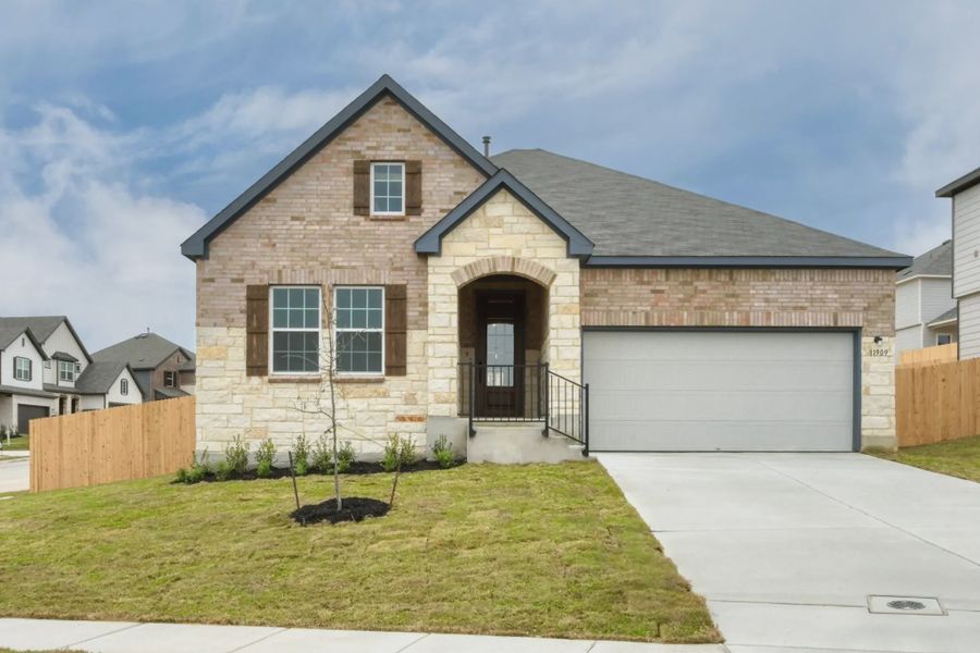 Front exterior of a home in the Cordova Trails community, located in Seguin, TX (Image 2).