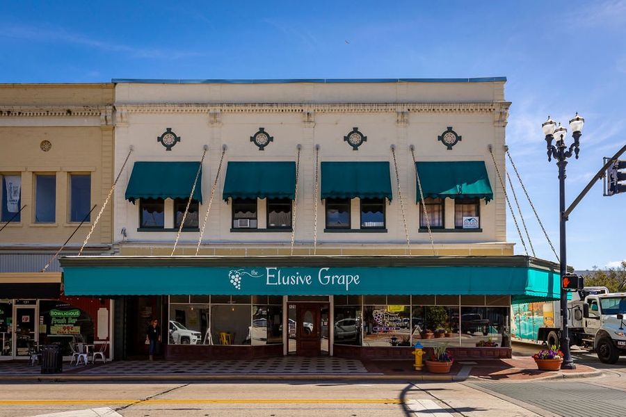 Discover the charm of Downtown DeLand including the Elusive Grape, a cozy winery with fine wines, gourmet bites, and a relaxed atmosphere | Beresford Woods | New Homes in DeLand, FL | Landsea Homes