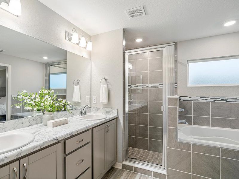 Enjoy the luxury of a spa-like en-suite bath - Parker model home in Silver Springs Shores