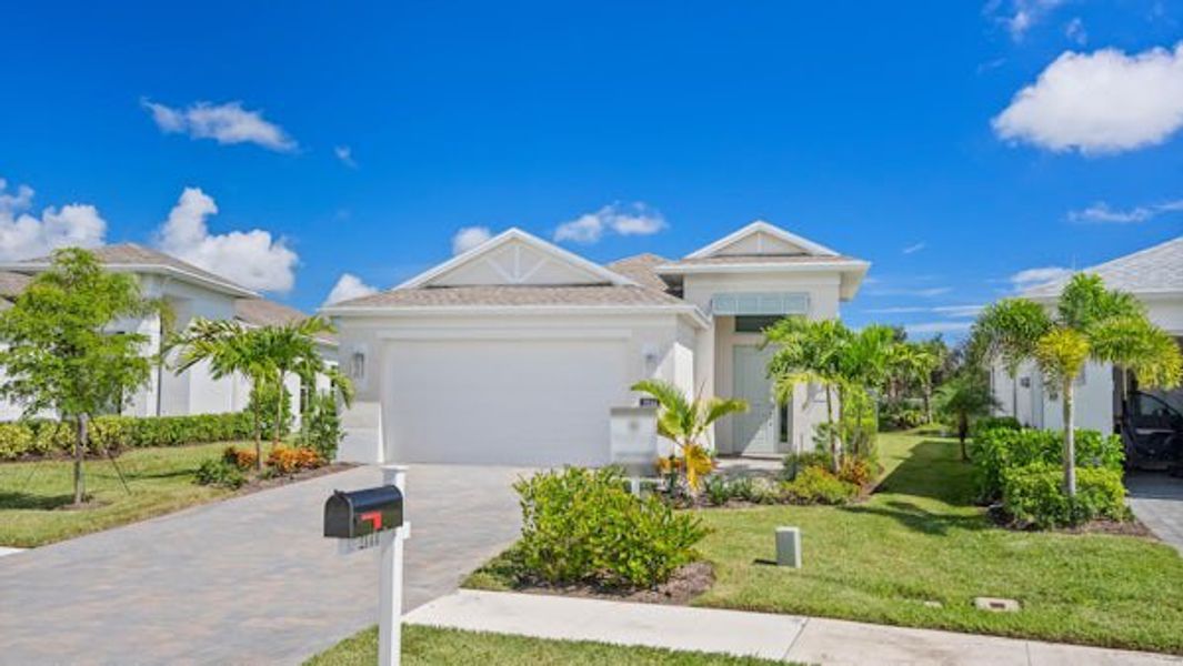 Front exterior of a home in the The Falls at Grand Harbor community, located in Vero Beach, FL (Image 46).