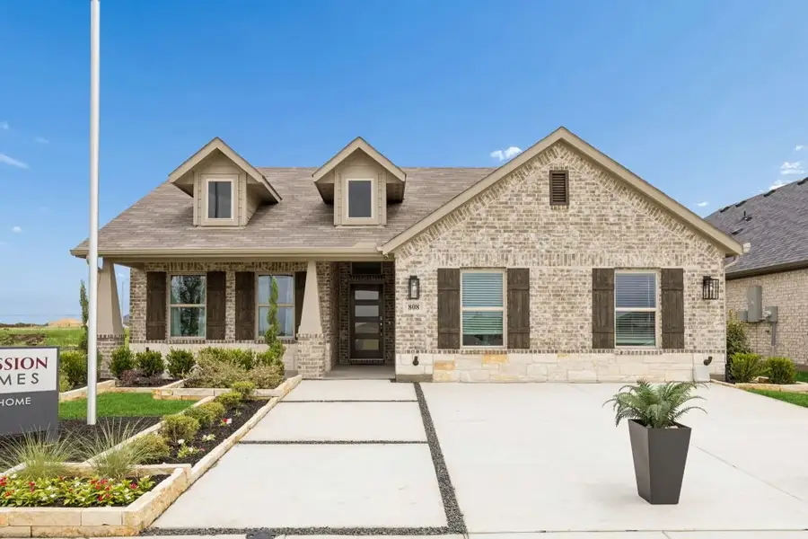 Front exterior of a home in the Terra Vella community, located in Haslet, TX (Image 2).