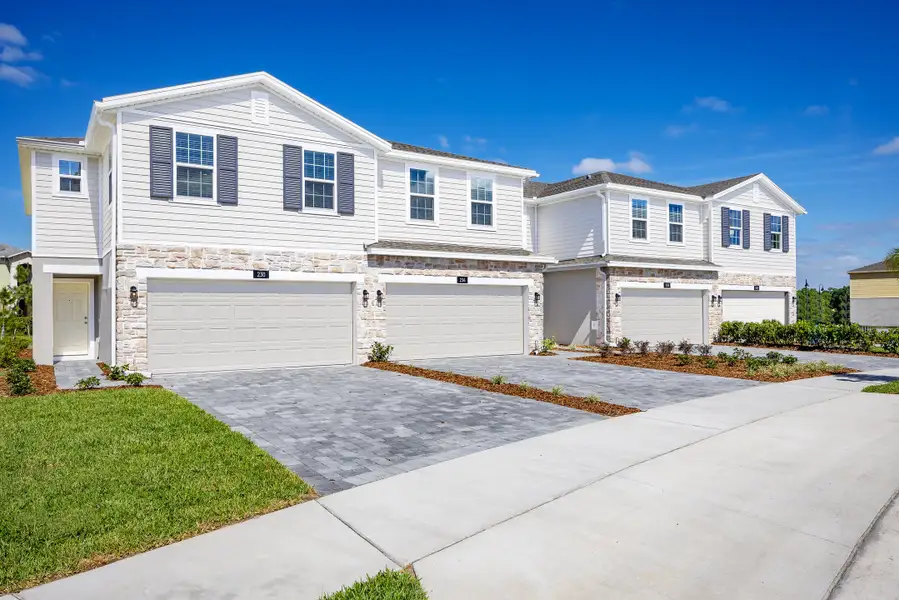 Front exterior of a home in the Thompson Village Townhomes community, located in Apopka, FL (Image 3).