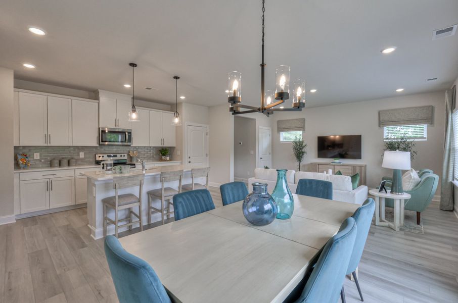 The stunning open-concept floorplan allows for an easy flow between the kitchen and dining areas. The stunning open-concept floorplan allows for an easy flow between the kitchen and dining areas.