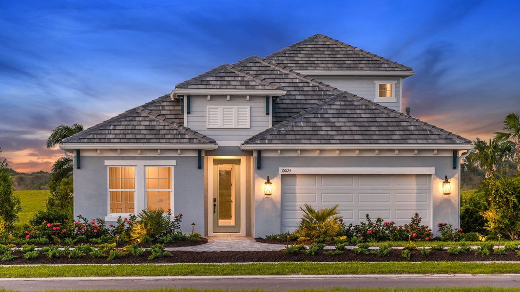 Front exterior of a home in the Grand Park Real Estate and Homes for Sale in Sarasota, FL - Neal Communities community, located in Sarasota, FL (Image 14).