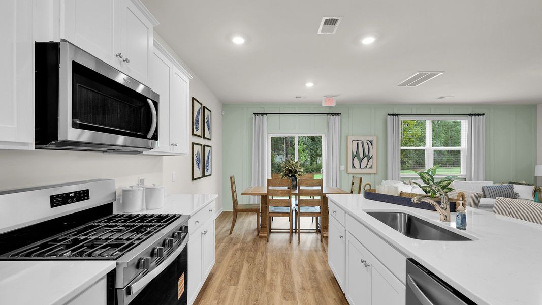 Furnished interior in a model home at The Cove at Mallard Crossing in Summerville (Image 4).