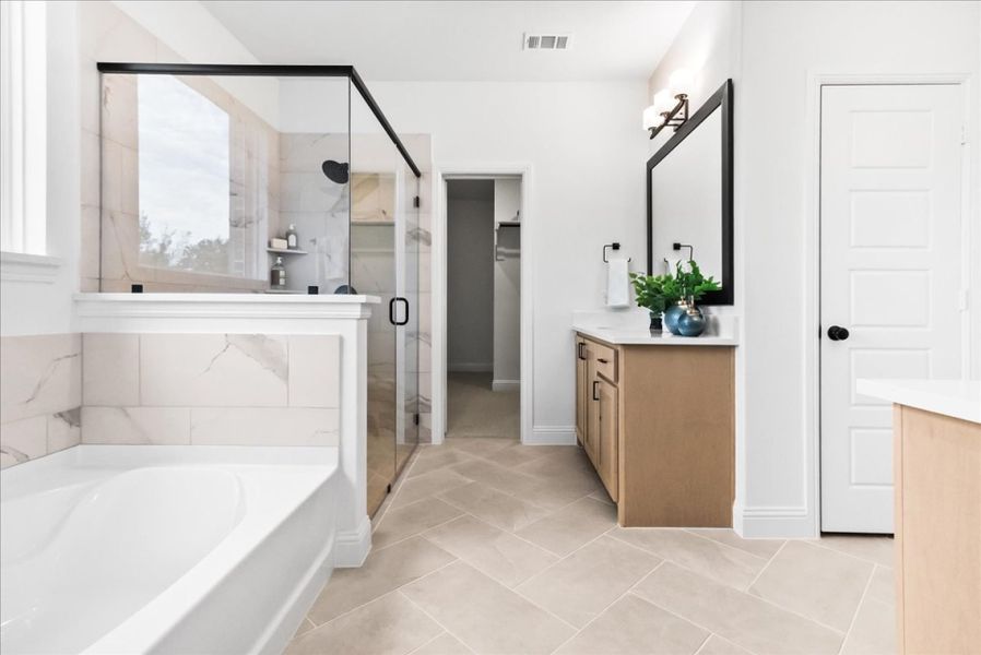 Furnished interior in a model home at The Reserve at Spiritas Ranch in Little Elm (Image 26).