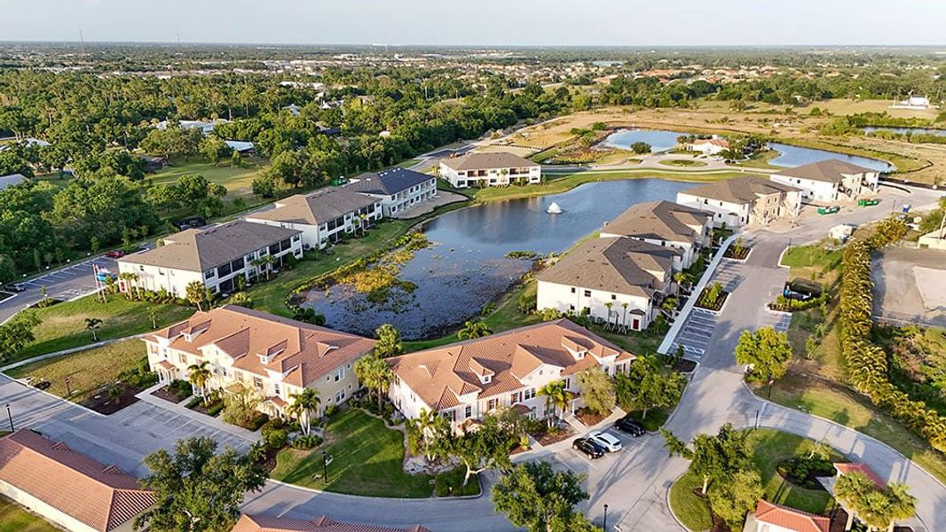 Aerial view of the Bella Via community in Port Charlotte, FL, showing layout and nearby surroundings (Image 1). Aerial view of the Bella Via community in Port Charlotte, FL, showing layout and nearby surroundings (Image 1).