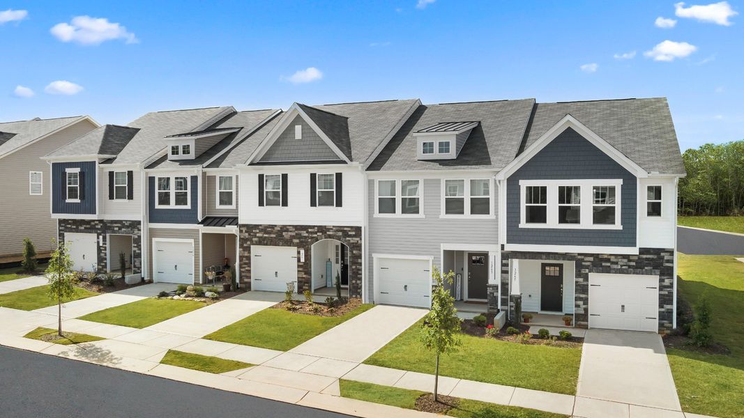 Front exterior of a home in the Sidney Creek Townhomes community, located in Zebulon, NC (Image 8).