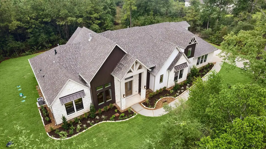 Front exterior of a home in the Republic Grand Ranch community, located in Willis, TX (Image 5).