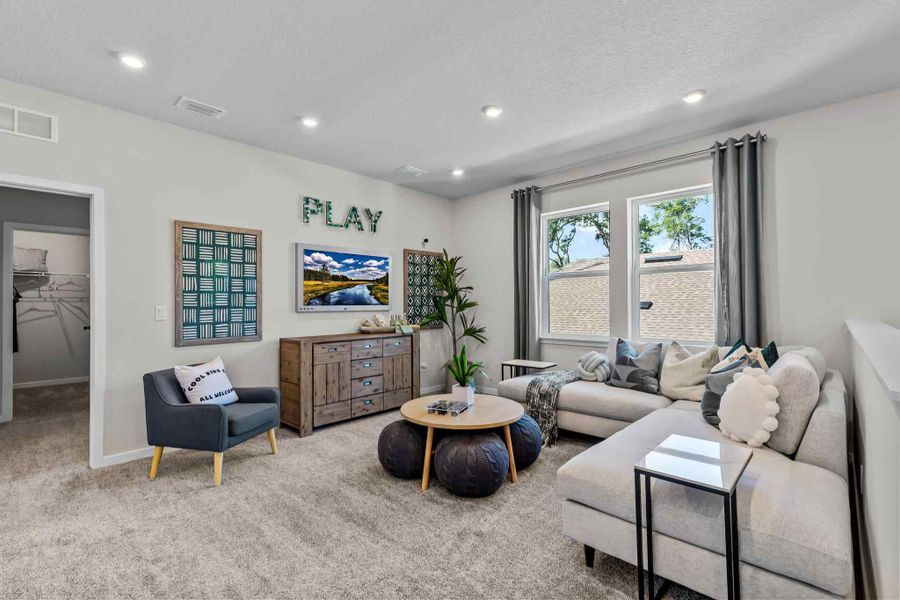A living room with a couch and a table.