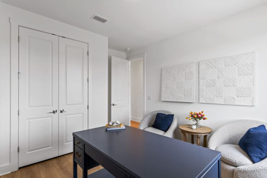 Furnished interior in a model home at Brizo in Santa Rosa Beach (Image 32).